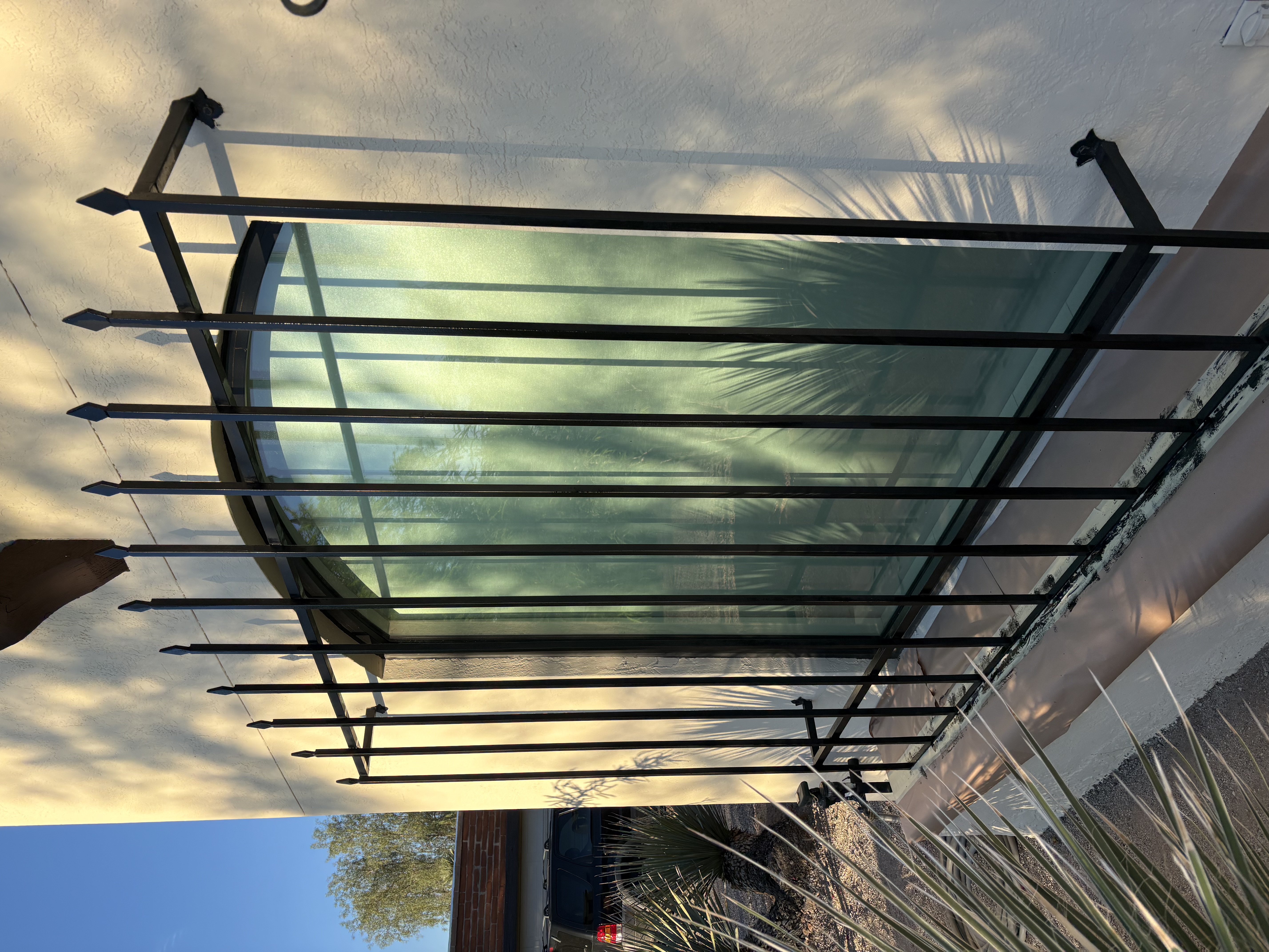 Custom wrought iron window security bars &mdash; arched window