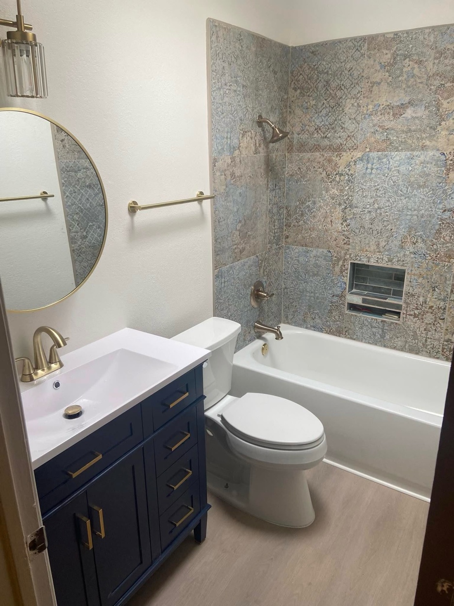 Bathroom after remodel &mdash; new vanity, tile, and fixtures